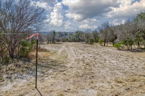 a fire hydrant in middle of the middle of a yard