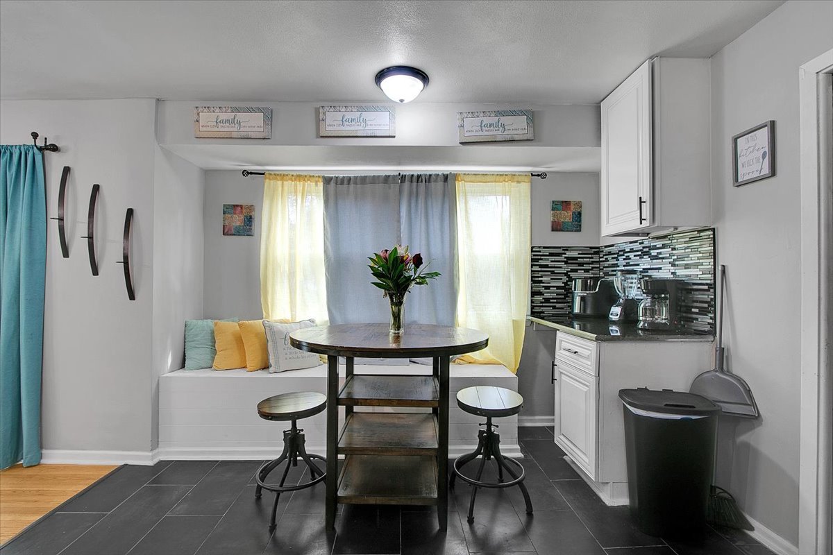 1708 Montague Road Rockford, IL 61102 - Photo 16 of 39 a living room with furniture and a potted plant