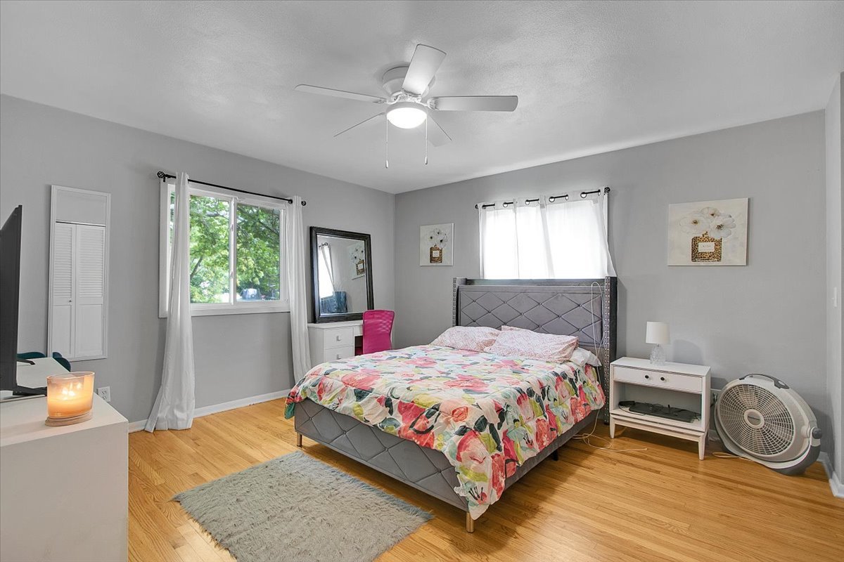 1708 Montague Road Rockford, IL 61102 - Photo 23 of 39 a bedroom with a bed and a chandelier