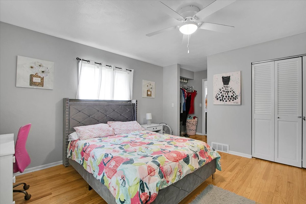 1708 Montague Road Rockford, IL 61102 - Photo 24 of 39 a bedroom with a bed and a chandelier