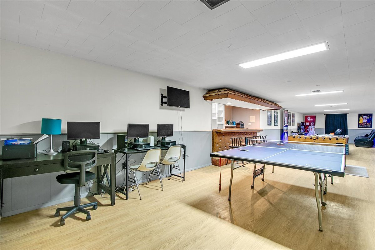 1708 Montague Road Rockford, IL 61102 - Photo 27 of 39 a living room with furniture pool table and a flat screen tv