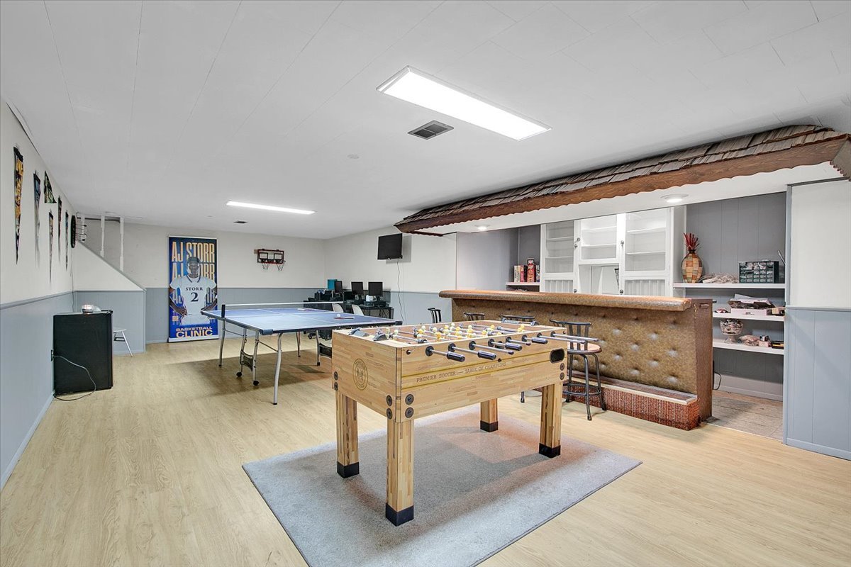 1708 Montague Road Rockford, IL 61102 - Photo 29 of 39 a living room with furniture a fireplace and a view of kitchen