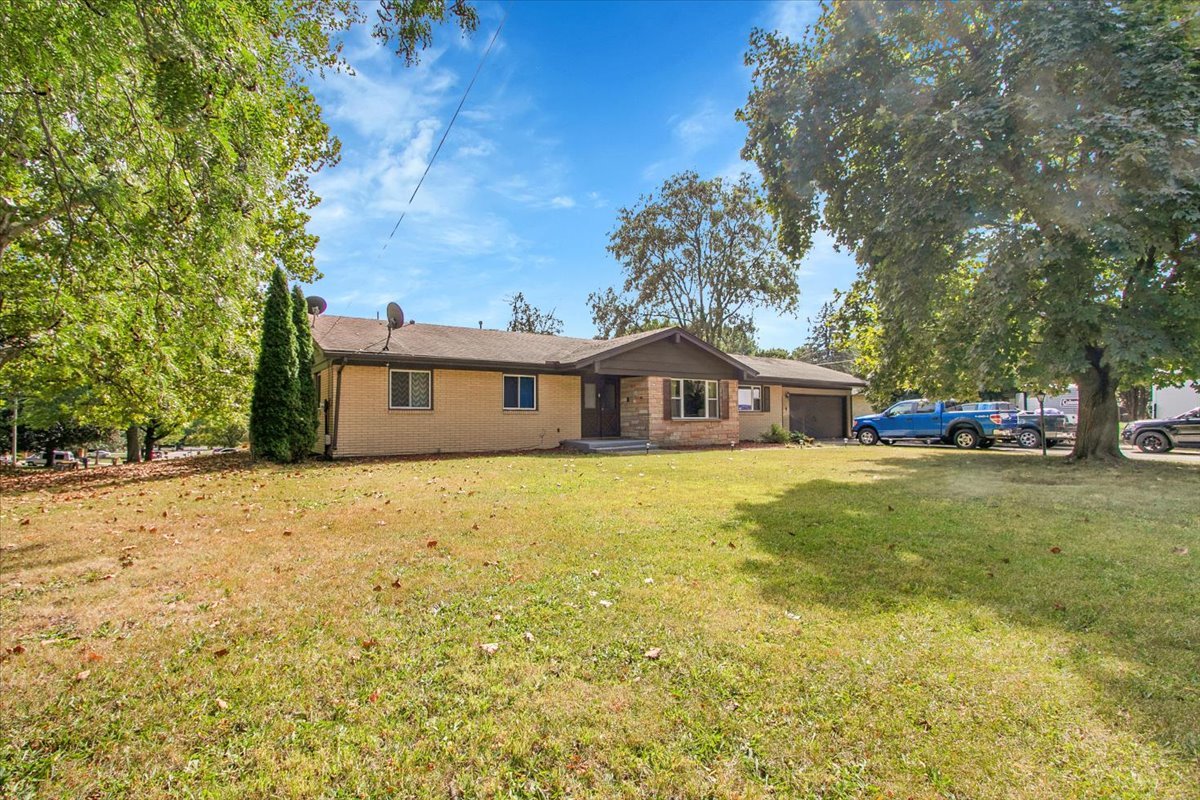 1708 Montague Road Rockford, IL 61102 - Photo 3 of 39 a front view of a house with a garden