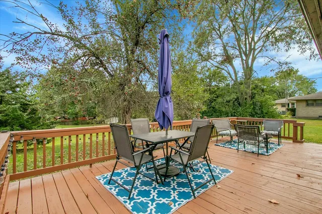 a view of a chairs and table on the wooden floor