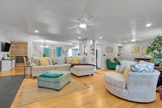 a living room with furniture and kitchen view
