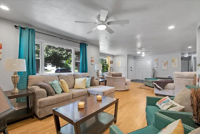 a living room with furniture and a large window