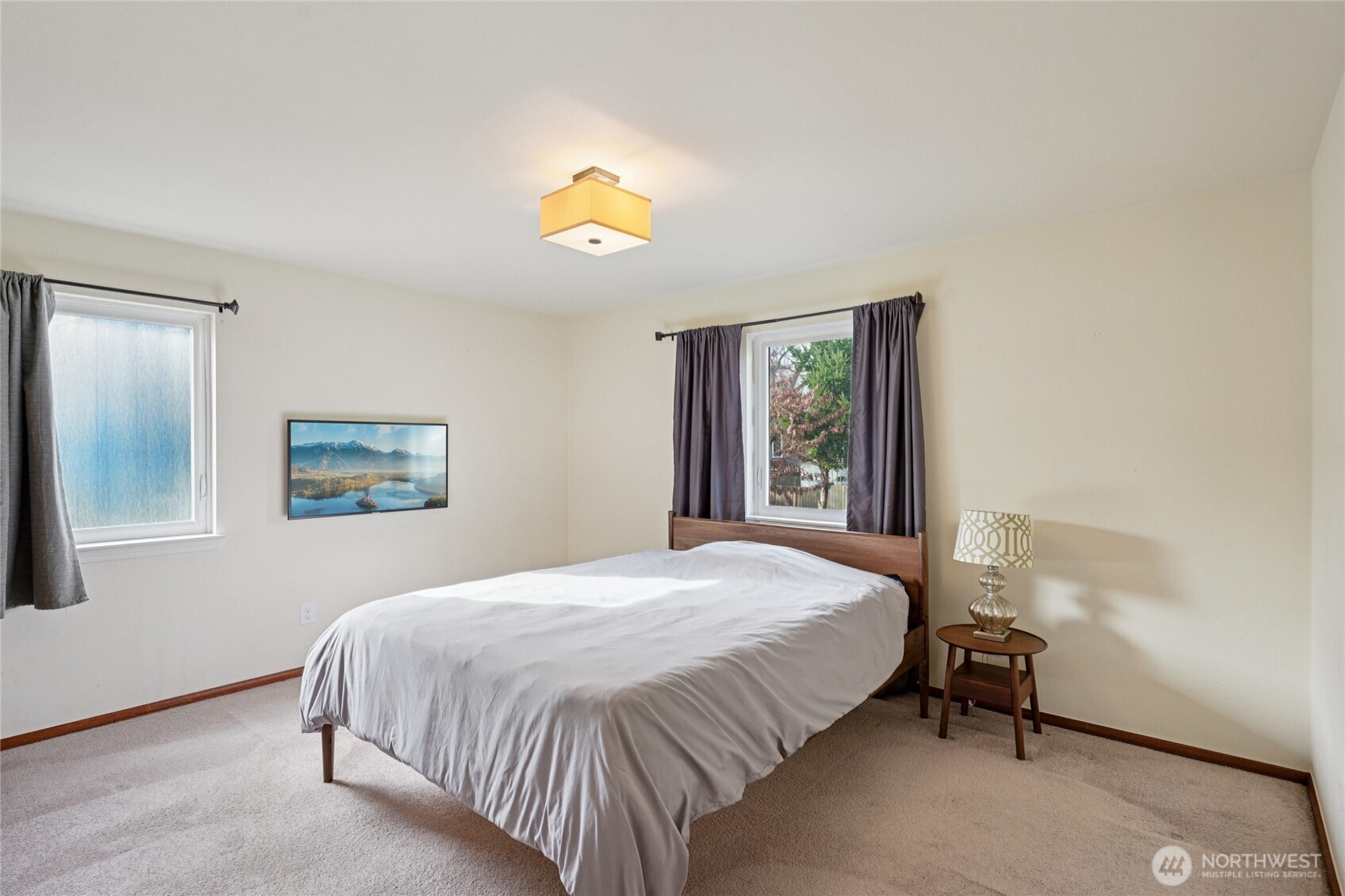 6628 Flora Avenue South Seattle, WA 98108 - Photo 12 of 32 a bedroom with a bed and a window