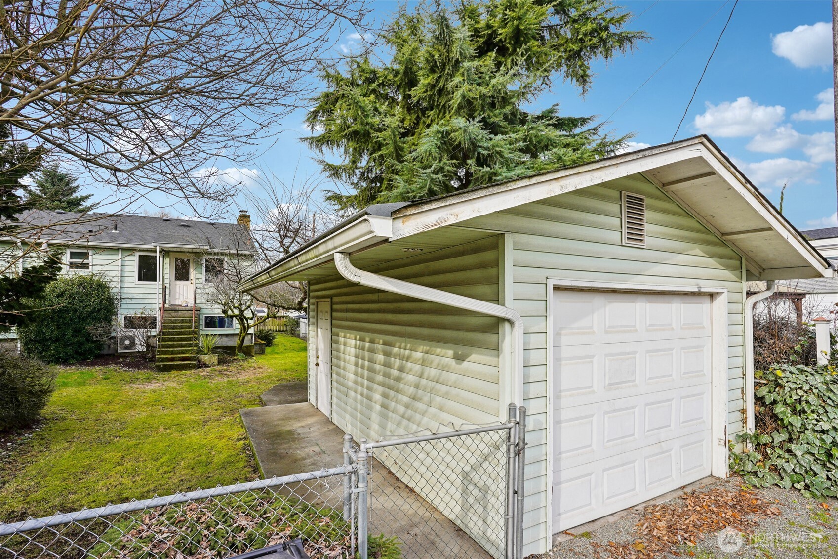6628 Flora Avenue South Seattle, WA 98108 - Photo 30 of 32 a front view of a house with garden