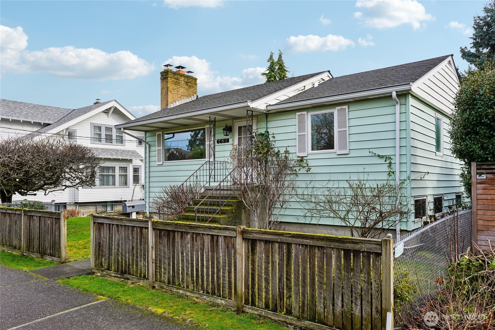 6628 Flora Avenue South Seattle, WA 98108 - Photo 31 of 32 a view of house with wooden deck and outdoor space