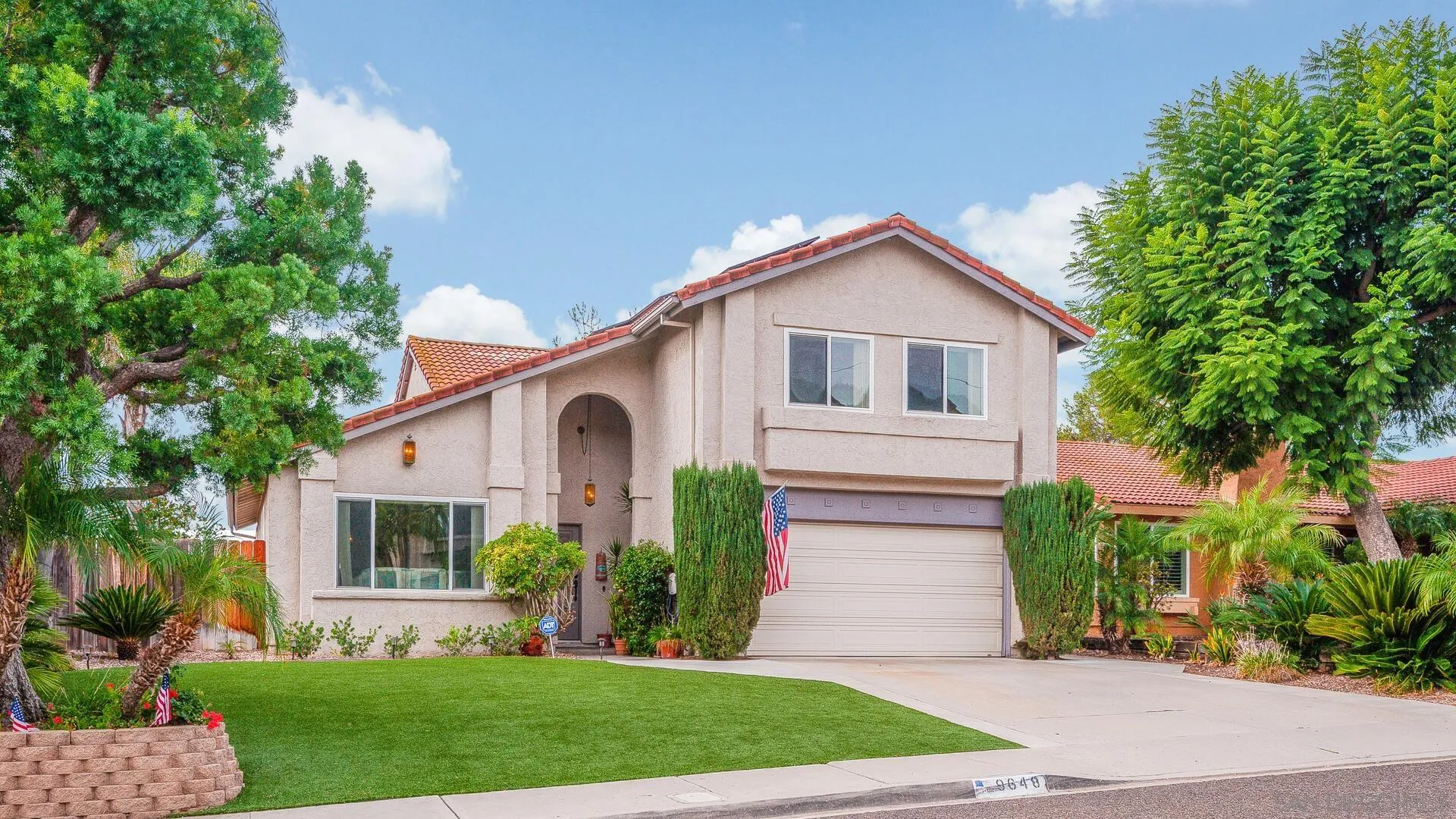 9648 Ramsgate Way Santee, CA 92071 - Photo 1 of 42 a view of a yard in front of a house with plants and large tree