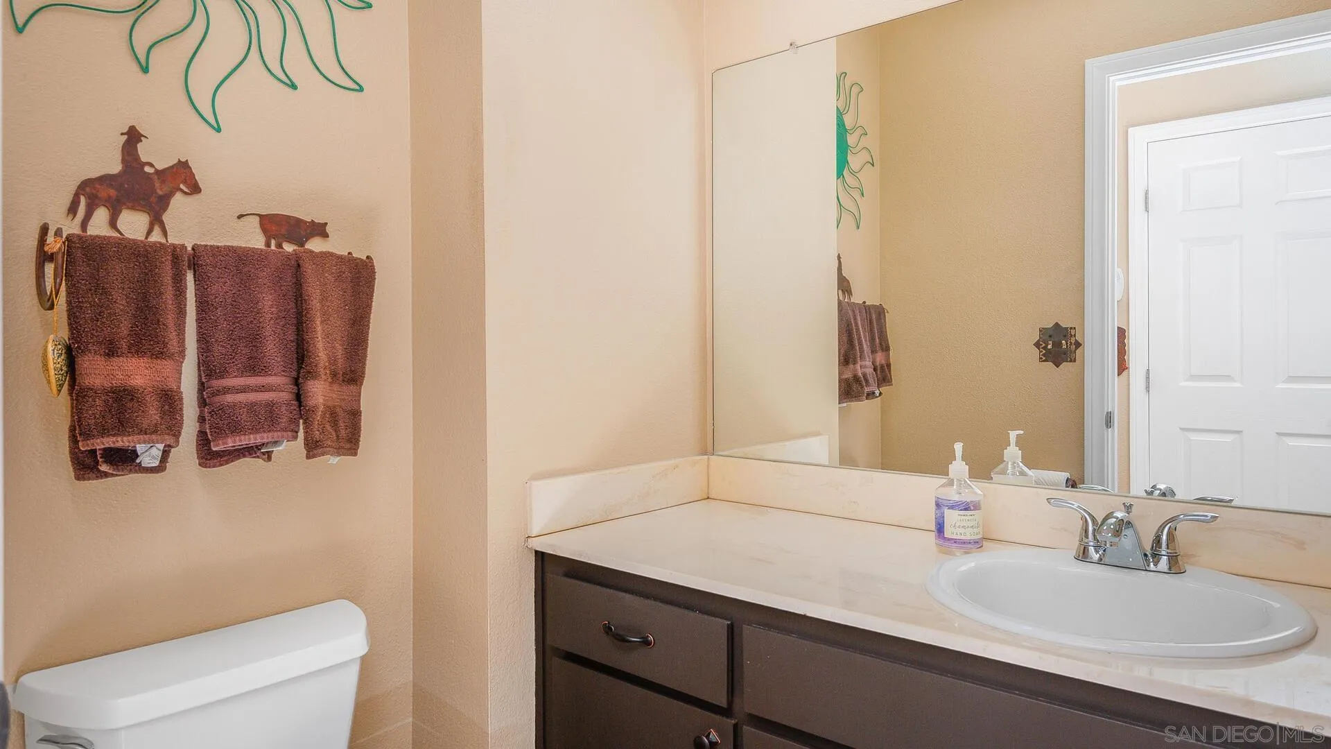 9648 Ramsgate Way Santee, CA 92071 - Photo 14 of 42 a bathroom with a sink and a mirror