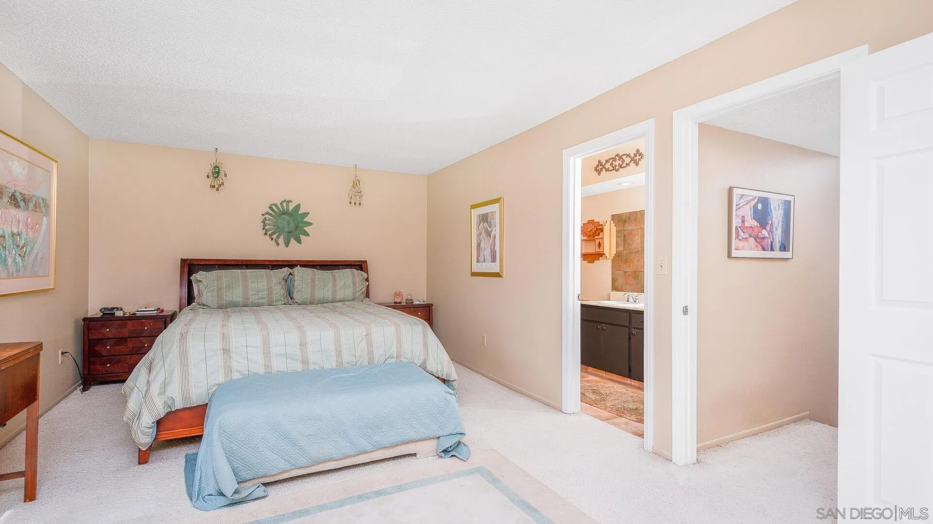 9648 Ramsgate Way Santee, CA 92071 - Photo 16 of 42 a bedroom with a bed and painting on the wall