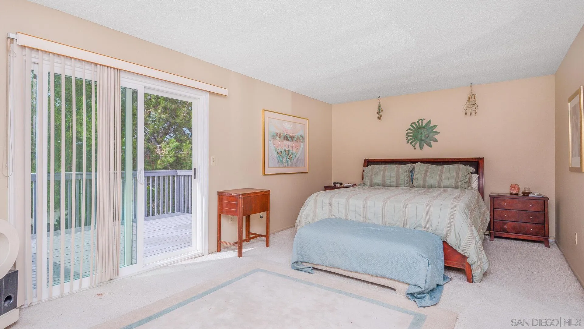 9648 Ramsgate Way Santee, CA 92071 - Photo 18 of 42 a bedroom with a bed lamp and a large window