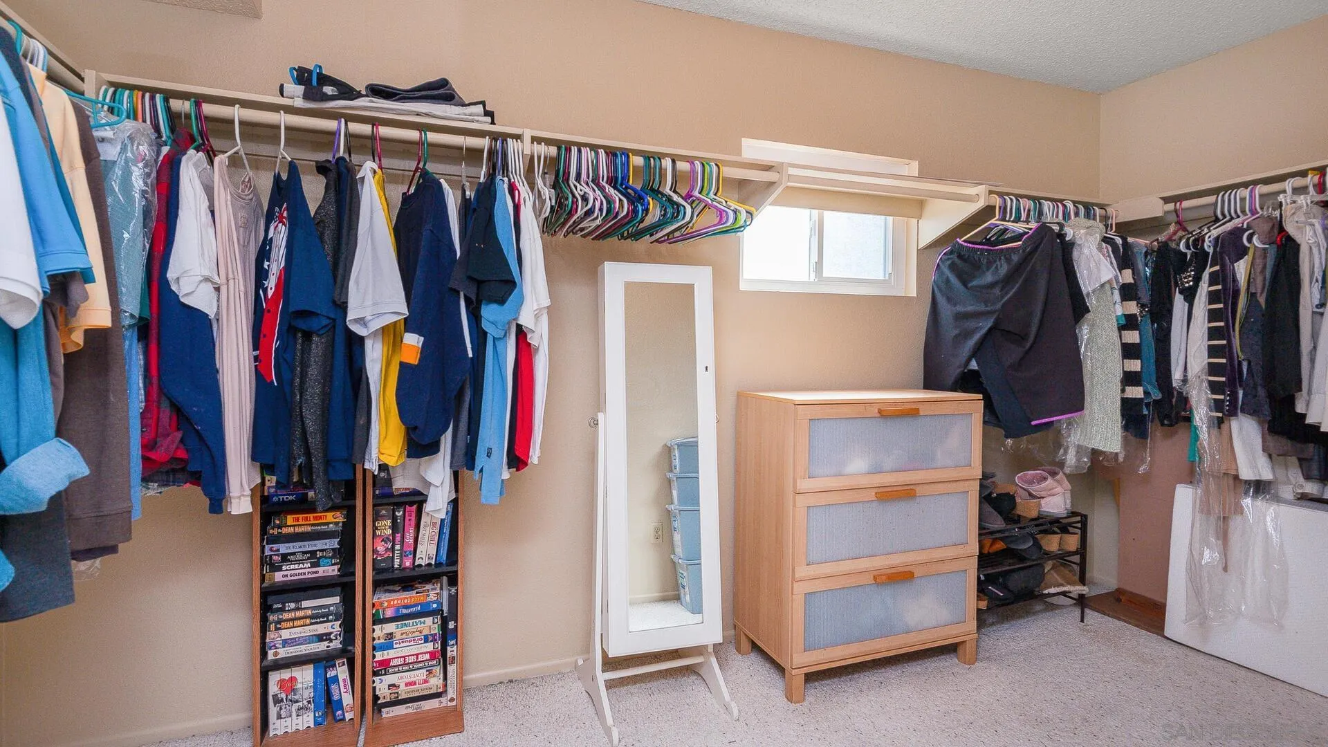 9648 Ramsgate Way Santee, CA 92071 - Photo 19 of 42 a view of walk in closet with clothes and shoes