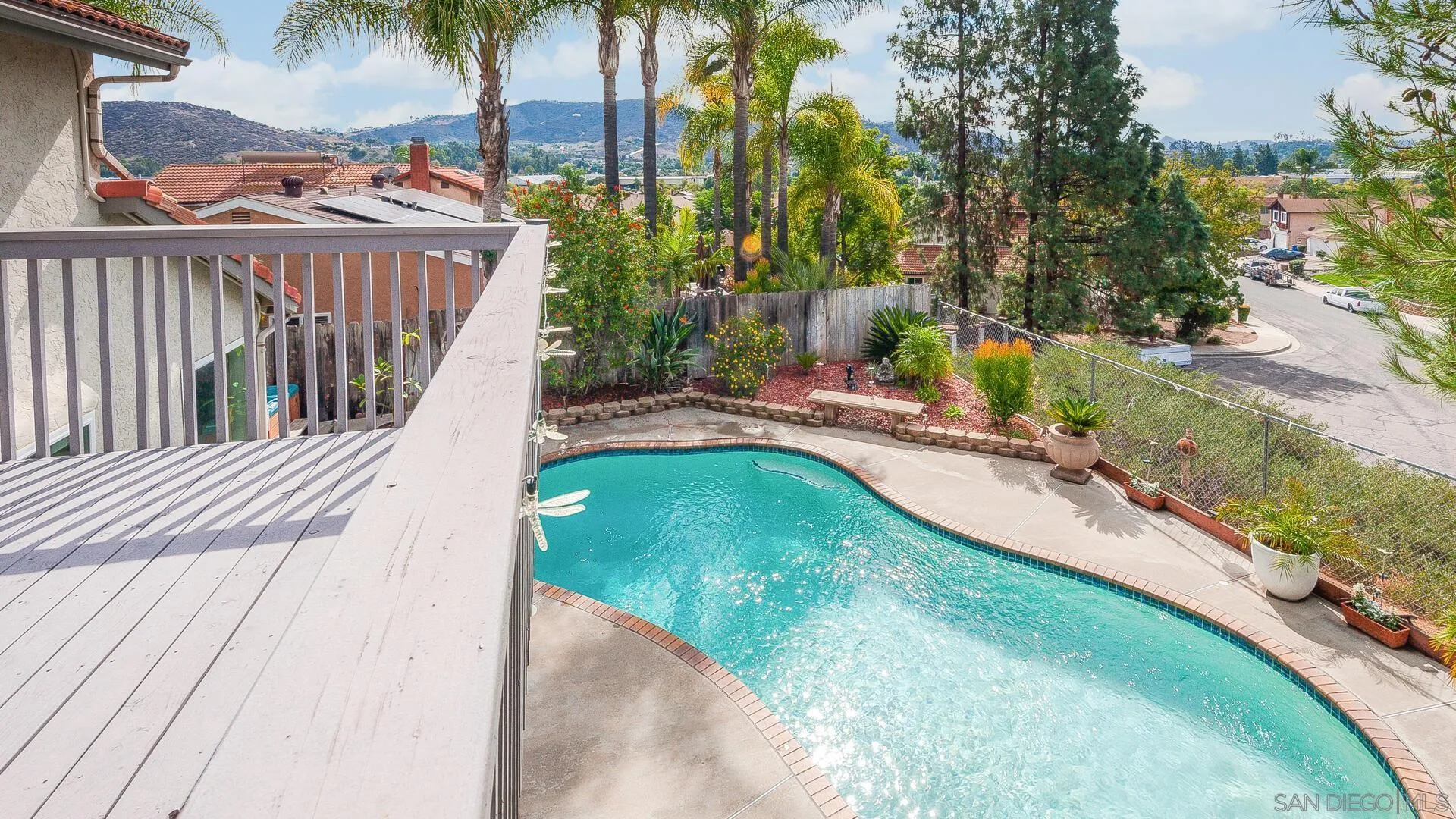 9648 Ramsgate Way Santee, CA 92071 - Photo 22 of 42 a view of a swimming pool with a garden