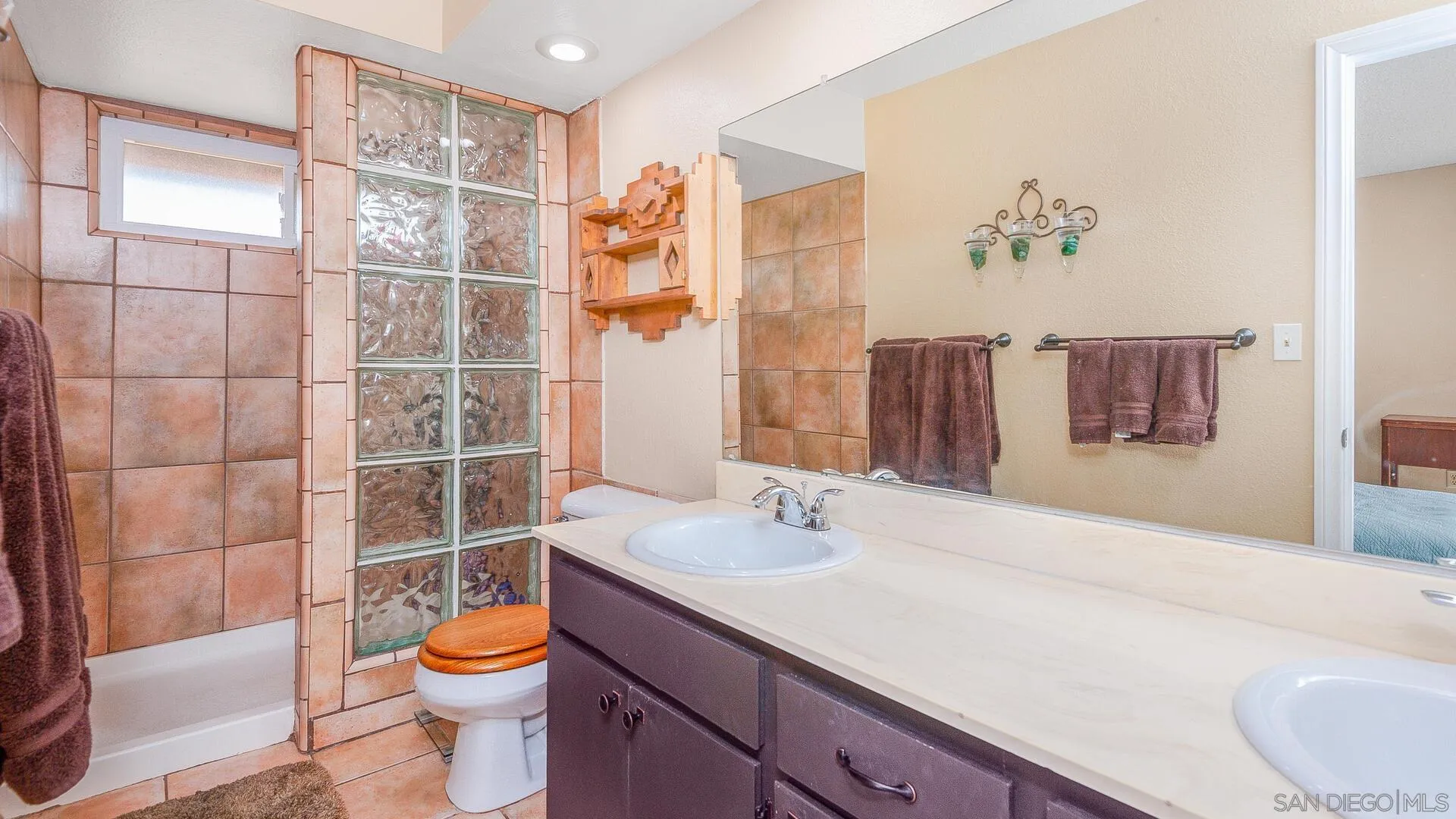 9648 Ramsgate Way Santee, CA 92071 - Photo 23 of 42 a bathroom with a sink toilet and shower