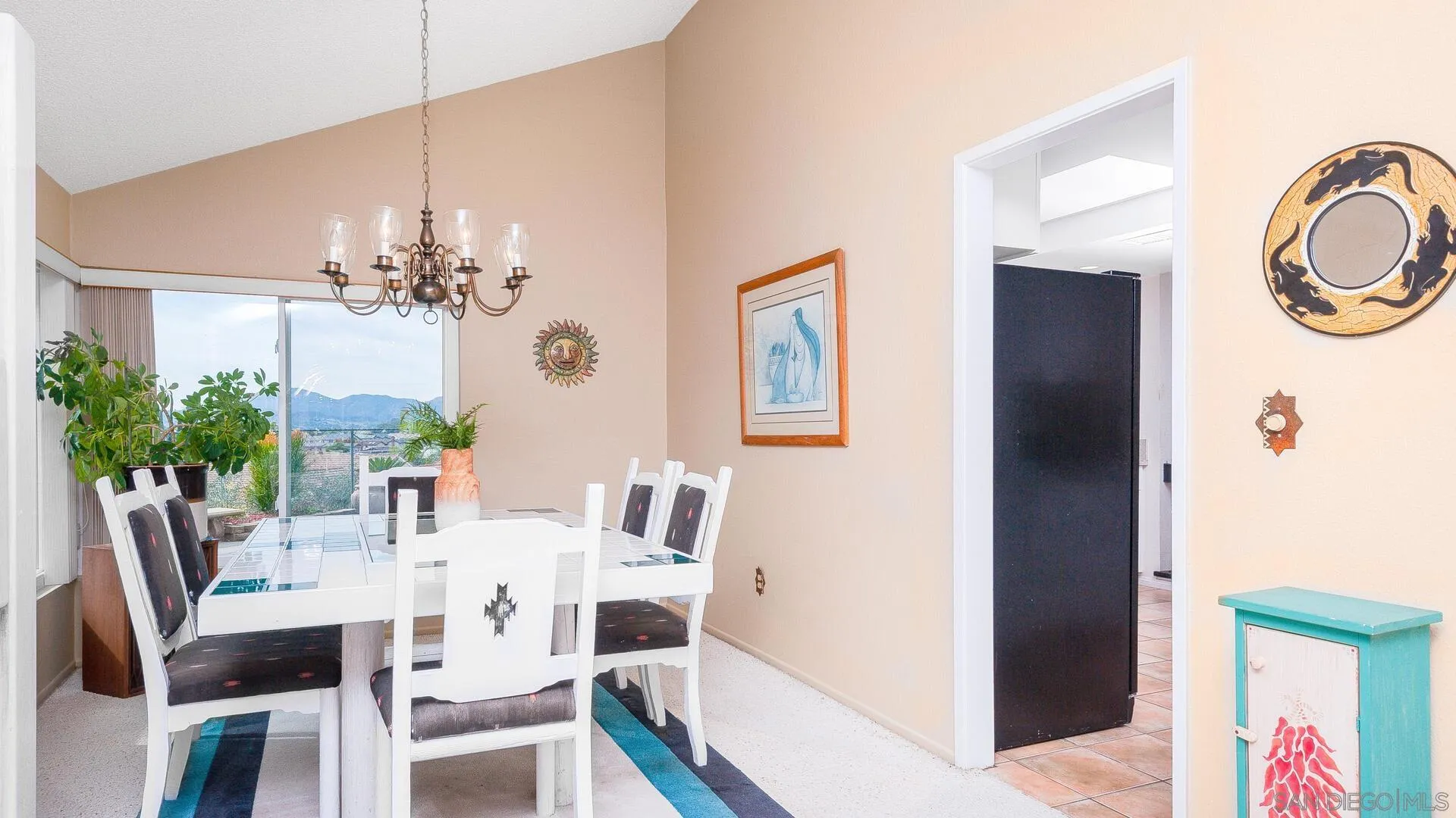 9648 Ramsgate Way Santee, CA 92071 - Photo 7 of 42 a view of a dining room with furniture and chandelier