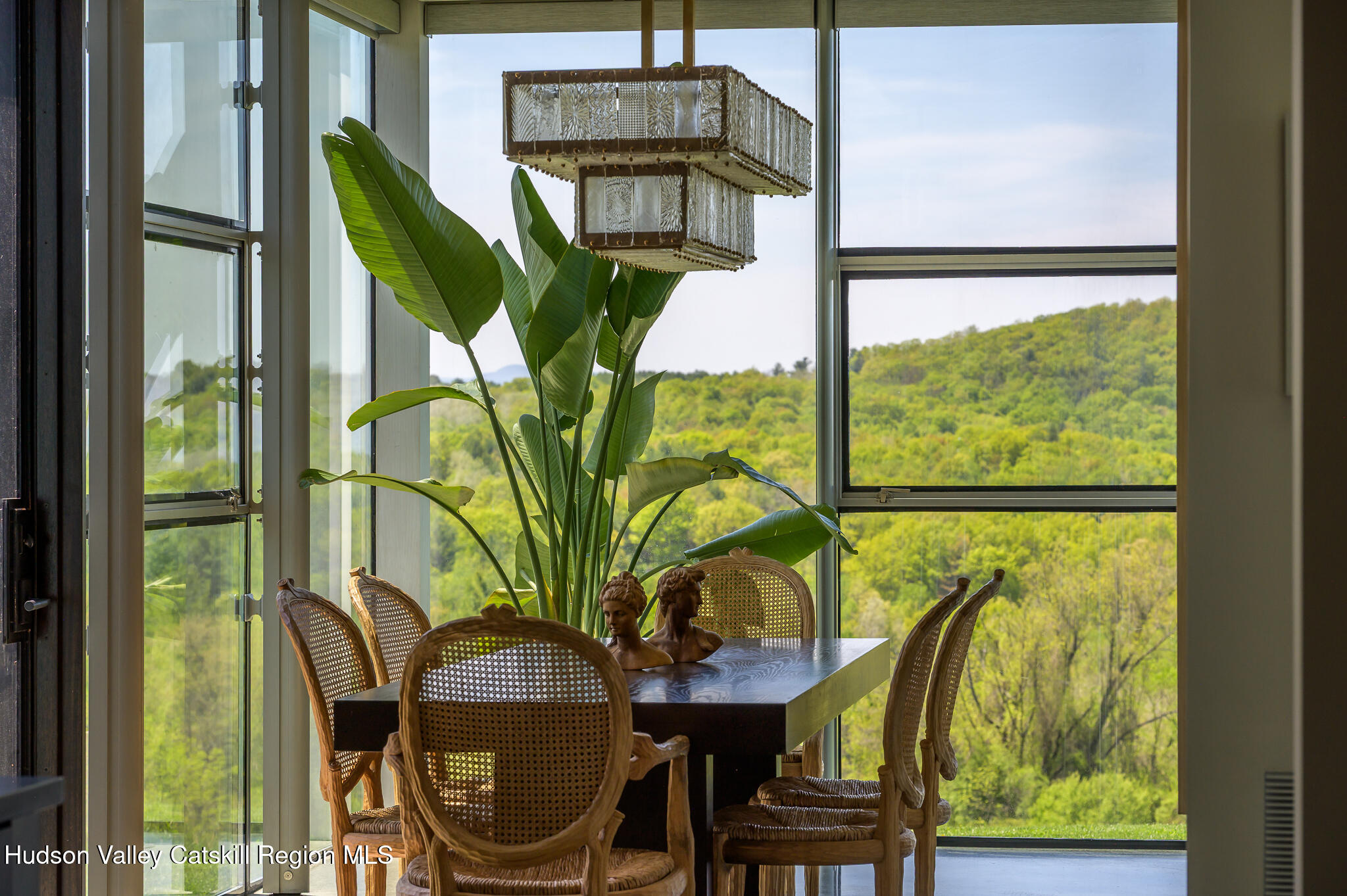 837 Carlson Road Craryville, NY 12521 - Photo 22 of 65 a dining room with furniture and a floor to ceiling window