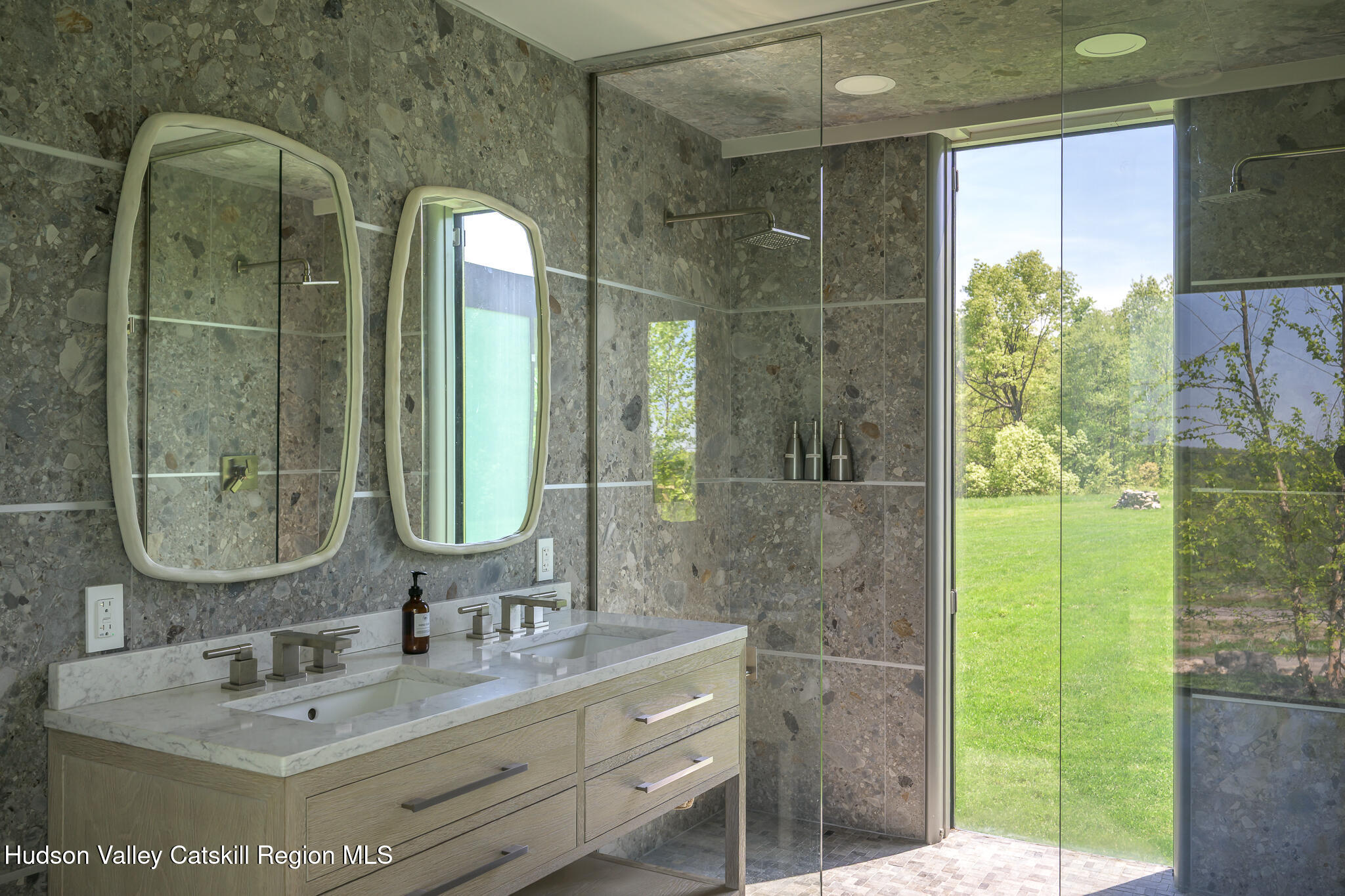 837 Carlson Road Craryville, NY 12521 - Photo 37 of 65 a bathroom with a double vanity sink and a mirror