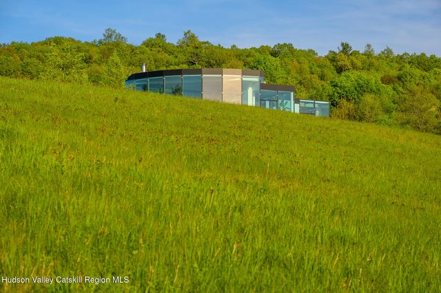 a view of a lake with houses in the back