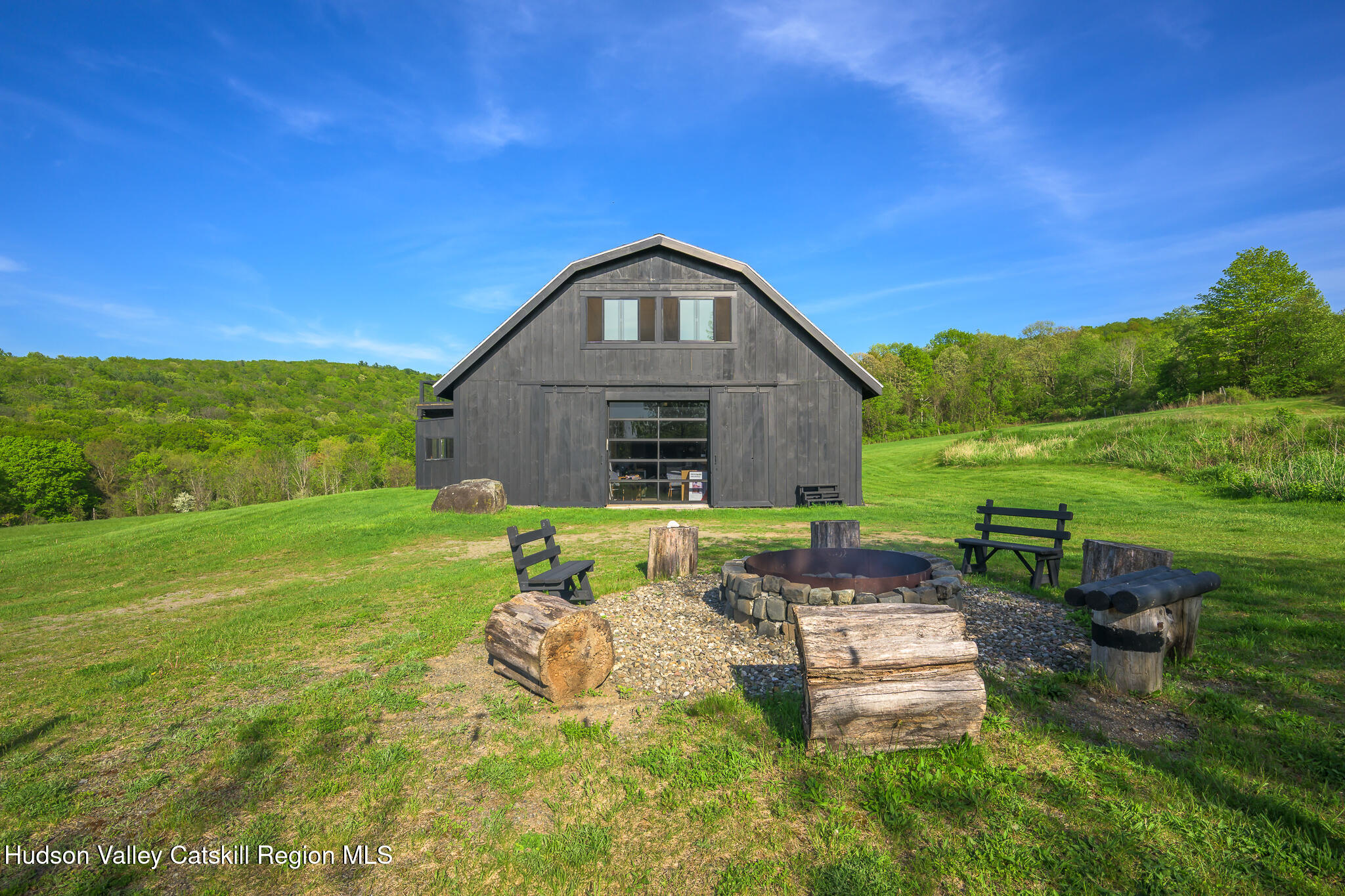 837 Carlson Road Craryville, NY 12521 - Photo 45 of 65 a backyard of a house with table and chairs