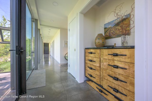 a view of a grassy field with trees