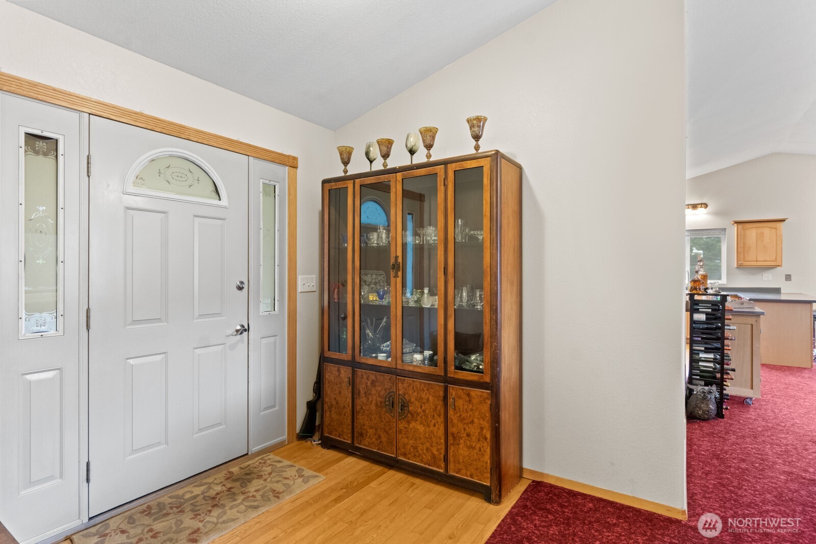 244 Martin Road Glenoma, WA 98336 - Photo 12 of 39 a view of a hallway with wooden floor and cabinet
