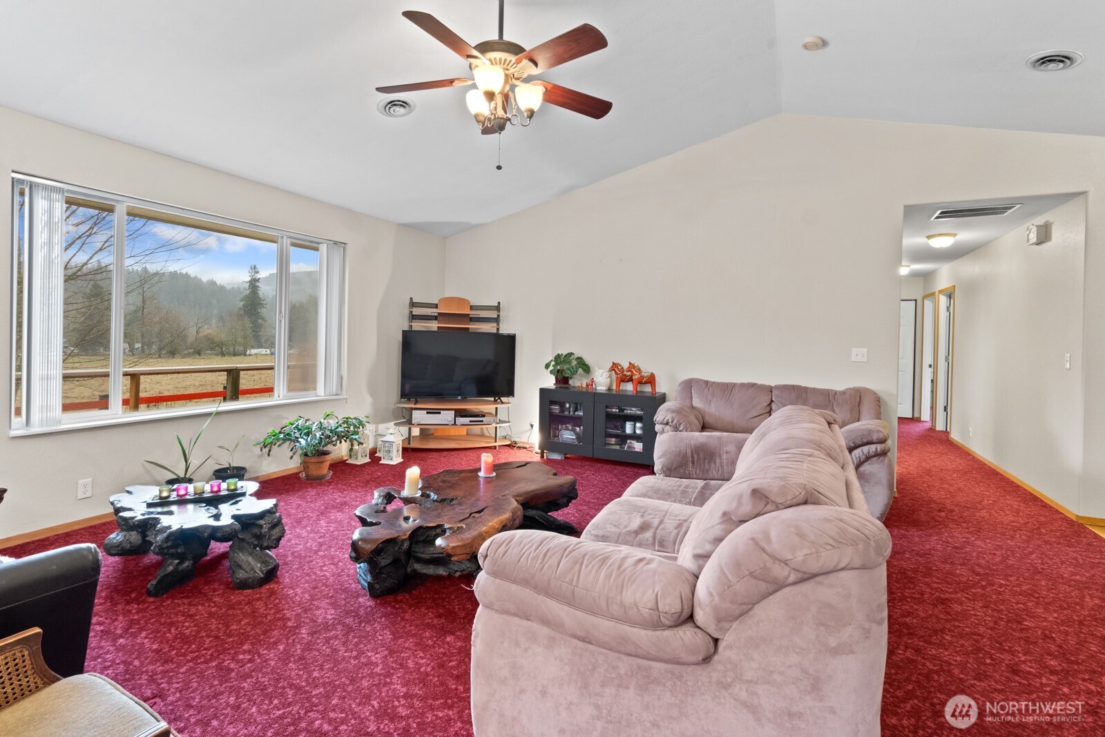 244 Martin Road Glenoma, WA 98336 - Photo 14 of 39 a living room with furniture a flat screen tv and a large window