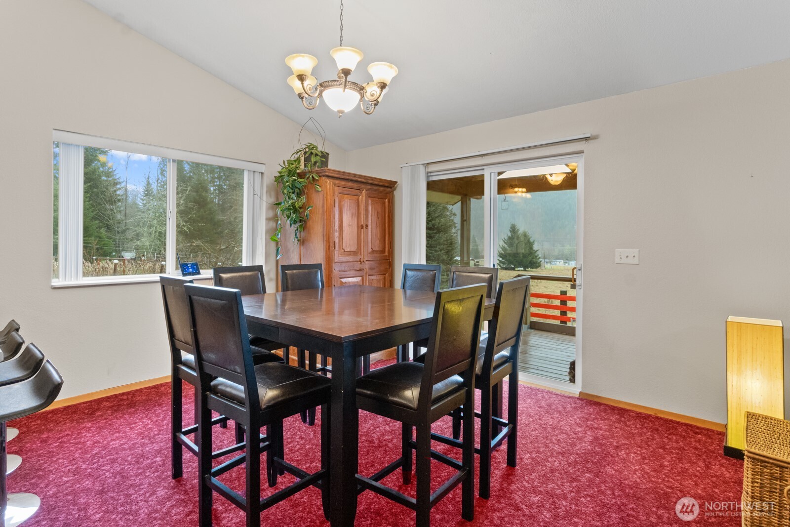 244 Martin Road Glenoma, WA 98336 - Photo 17 of 39 a view of a dining room with furniture wooden floor and chandelier