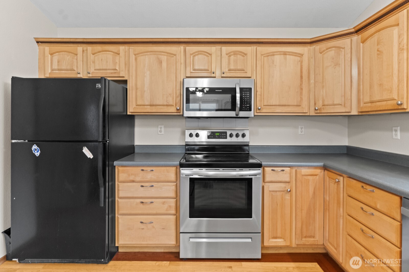 244 Martin Road Glenoma, WA 98336 - Photo 21 of 39 a kitchen with stainless steel appliances granite countertop a refrigerator stove and microwave