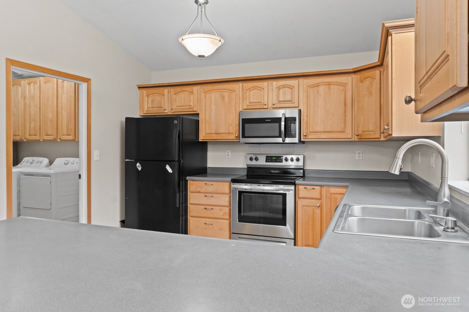 244 Martin Road Glenoma, WA 98336 - Photo 22 of 39 a kitchen with stainless steel appliances granite countertop a refrigerator stove top oven a sink and dishwasher