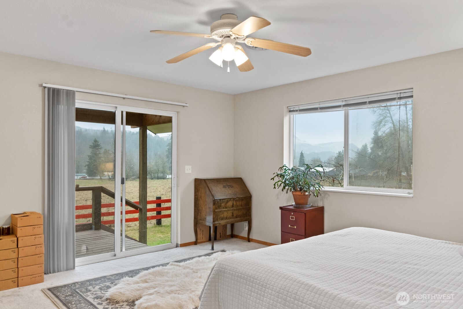 244 Martin Road Glenoma, WA 98336 - Photo 26 of 39 a bedroom with a balcony a bed and a chandelier