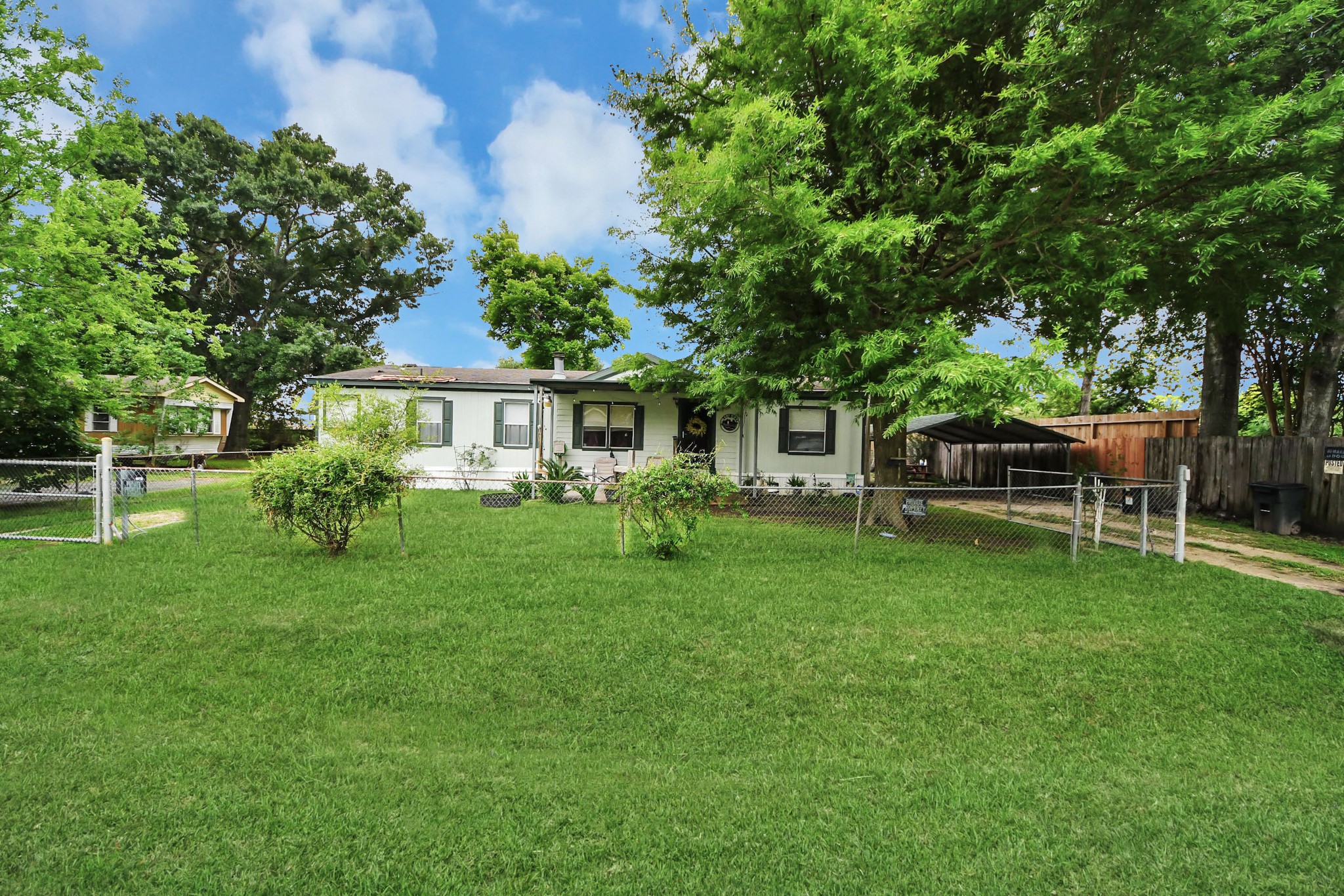 204 Edith Street Highlands, TX 77562 - Photo 2 of 33 a view of a house with a backyard and a patio