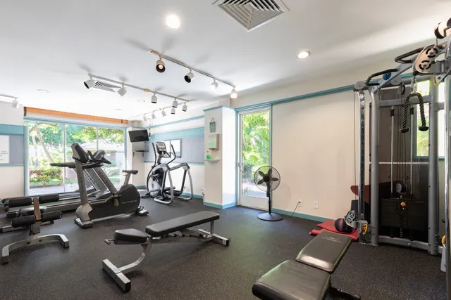 a dining room with furniture and garden view