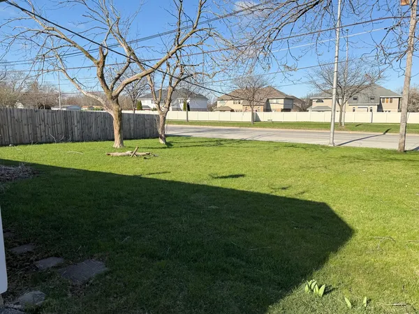 a view of a playground with a yard