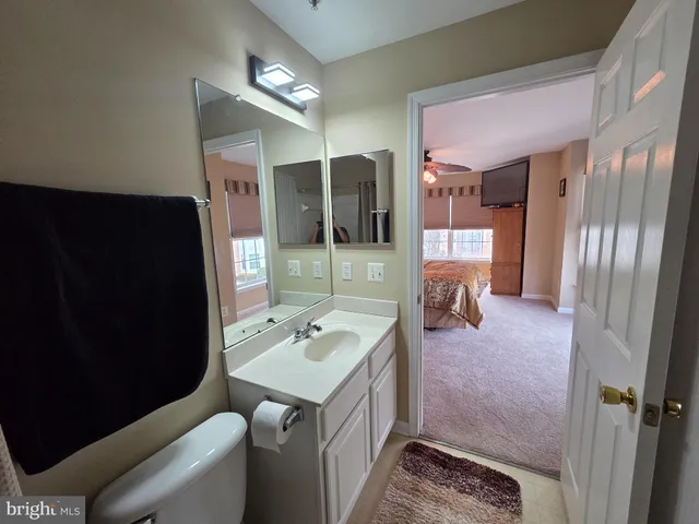 a bathroom with a sink double vanity and a mirror