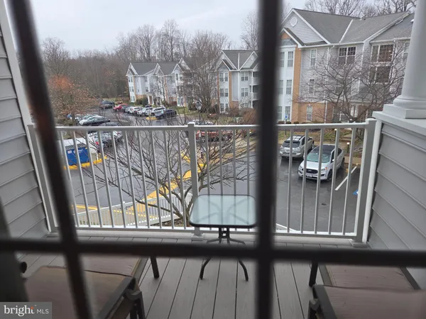 a view of balcony with furniture