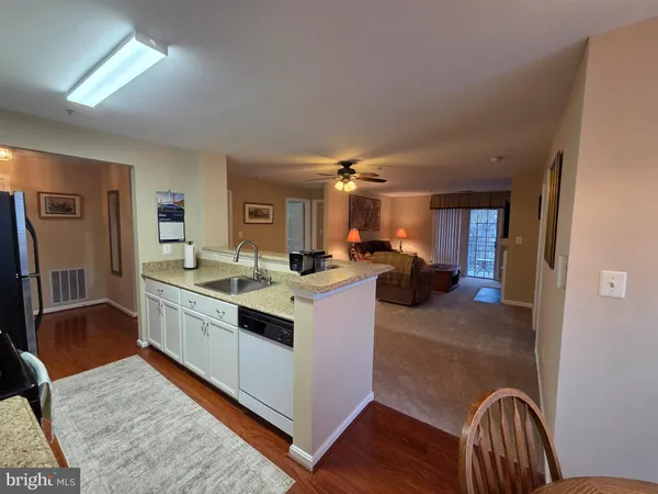 a view of living room with furniture and a couch