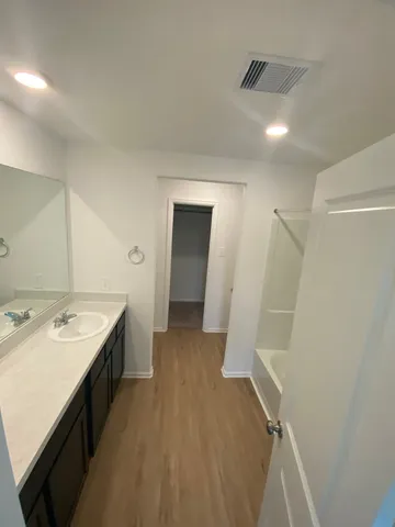 a bathroom with a sink and mirror