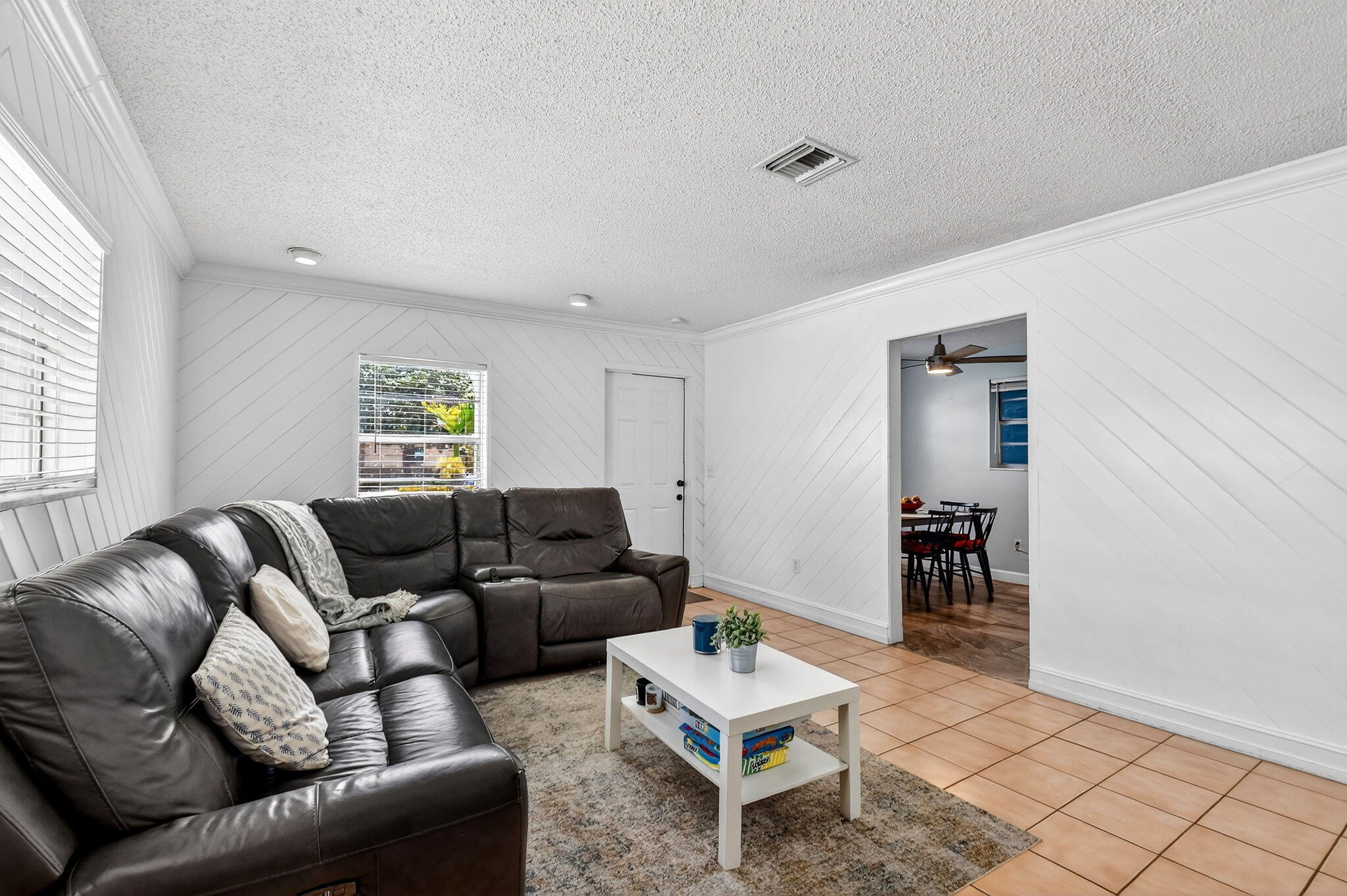 5721 Coconut Road West Palm Beach, FL 33413 - Photo 12 of 41 a living room with furniture and a table