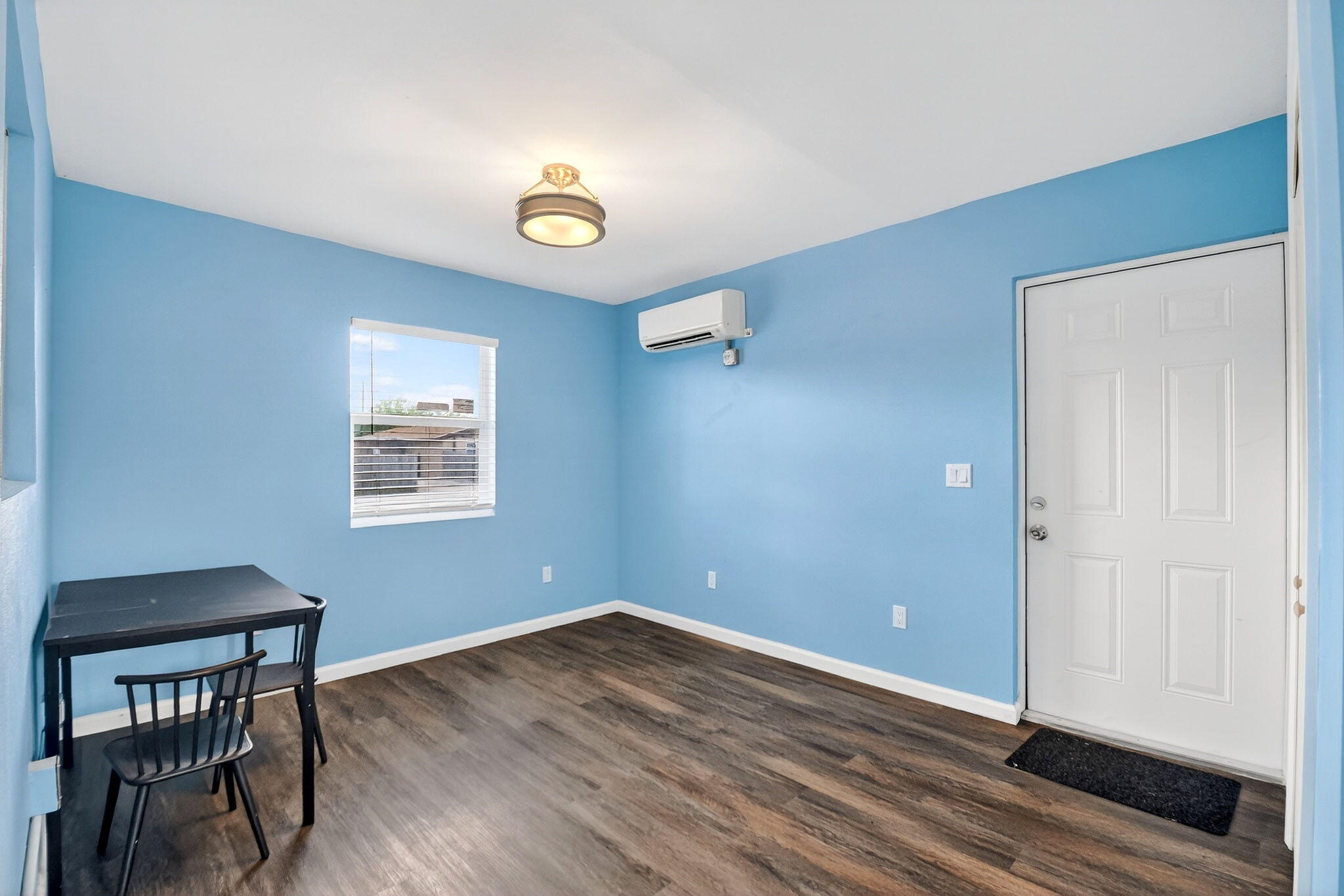 5721 Coconut Road West Palm Beach, FL 33413 - Photo 18 of 41 a view of room with window and wooden floor