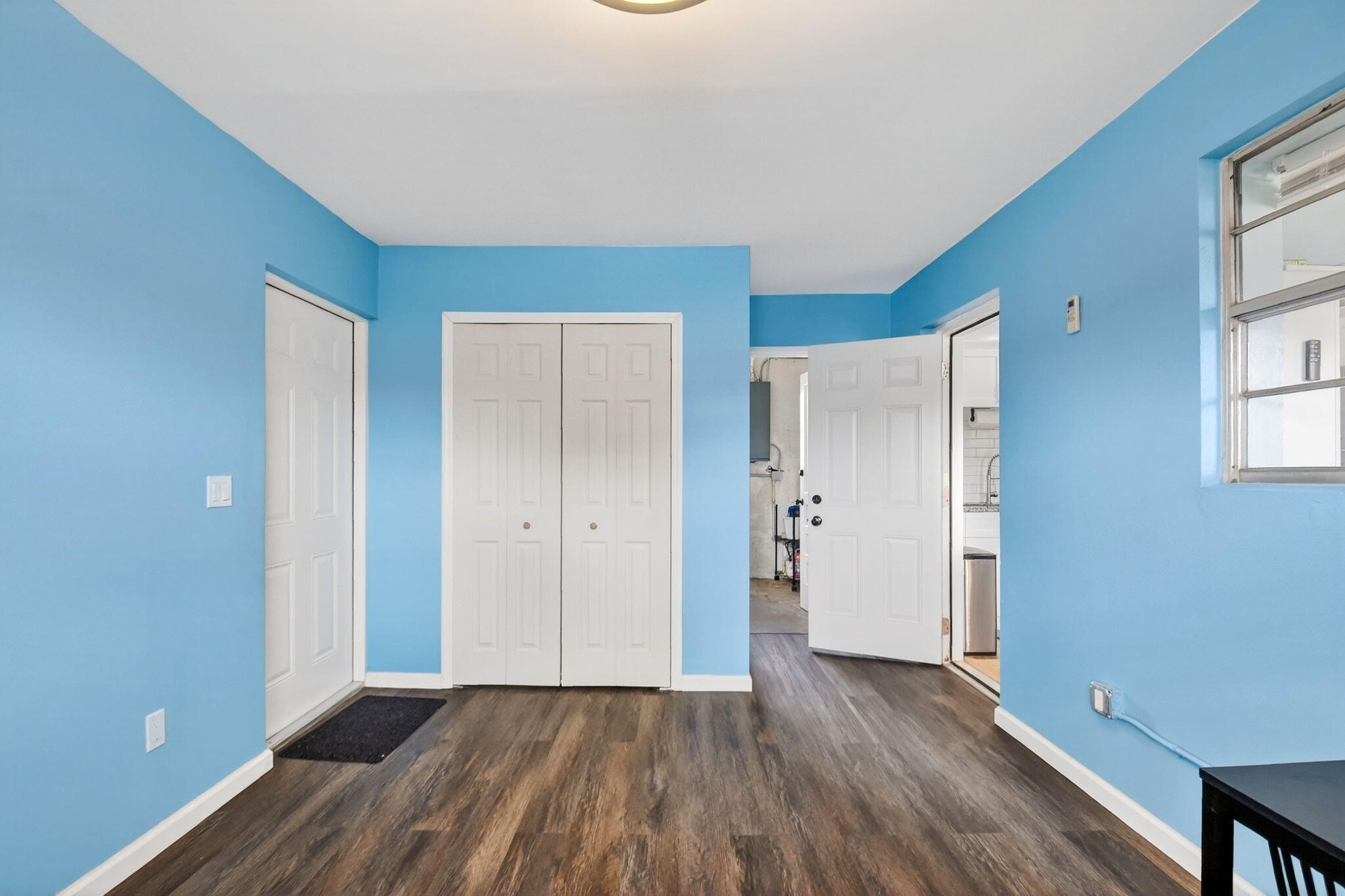 5721 Coconut Road West Palm Beach, FL 33413 - Photo 19 of 41 a view of a room with wooden floor and windows