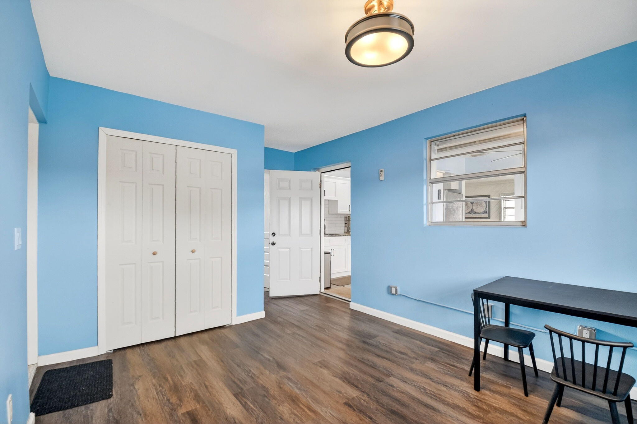 5721 Coconut Road West Palm Beach, FL 33413 - Photo 20 of 41 a view of room with window and wooden floor