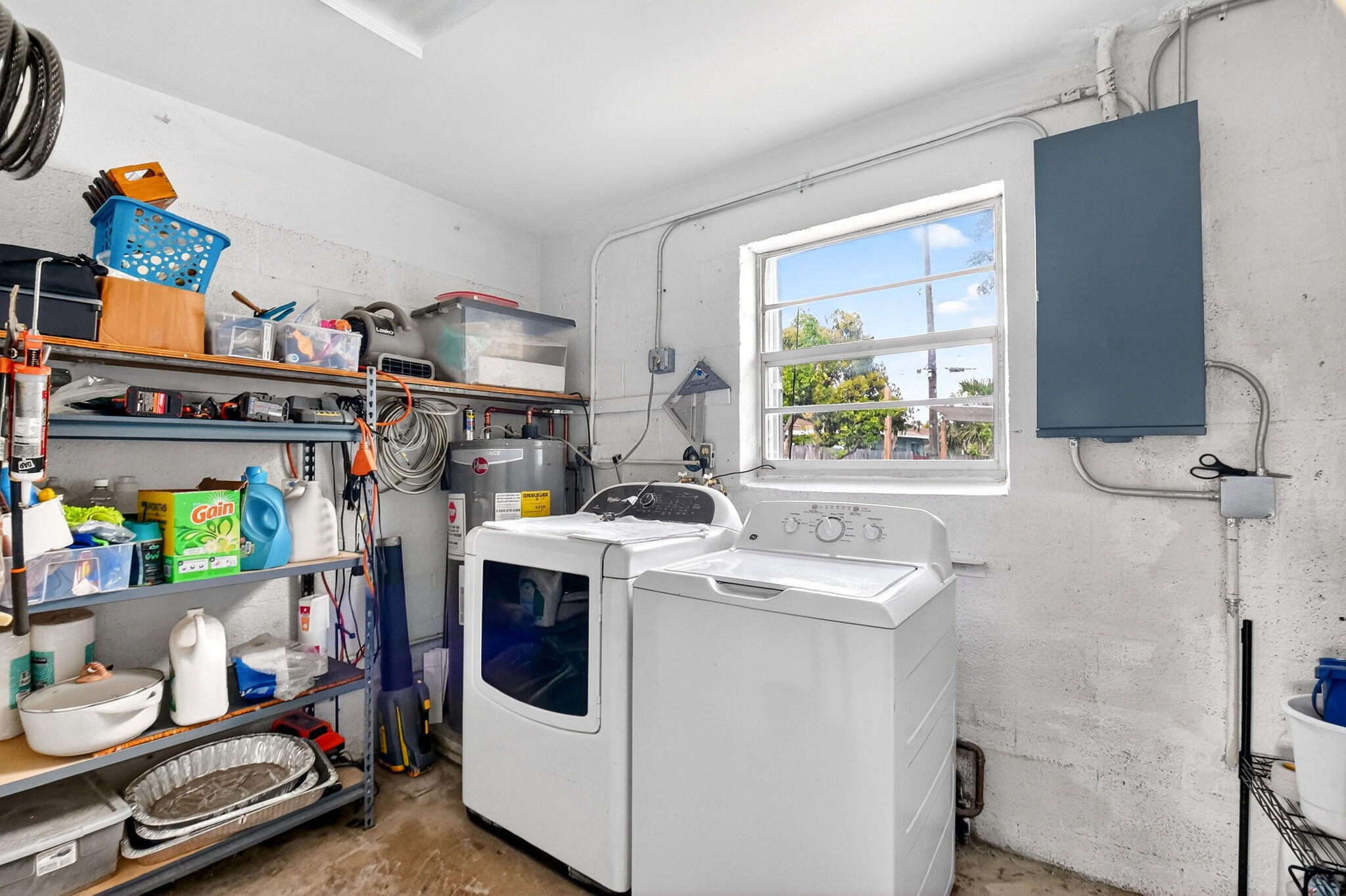5721 Coconut Road West Palm Beach, FL 33413 - Photo 21 of 41 a utility room with dryer washer and a window