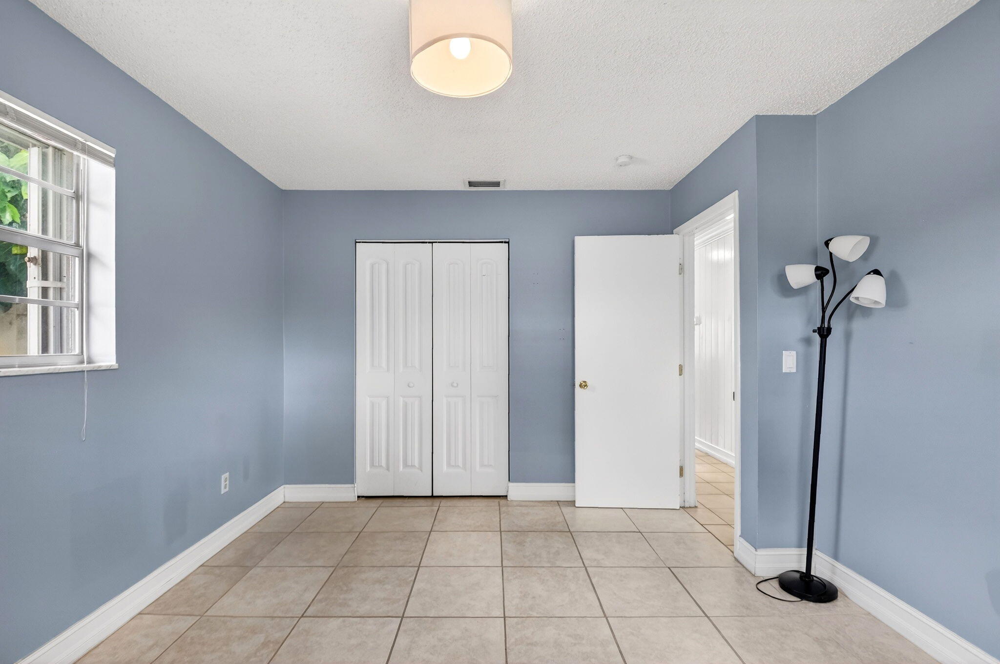5721 Coconut Road West Palm Beach, FL 33413 - Photo 24 of 41 a view of an empty room with a window