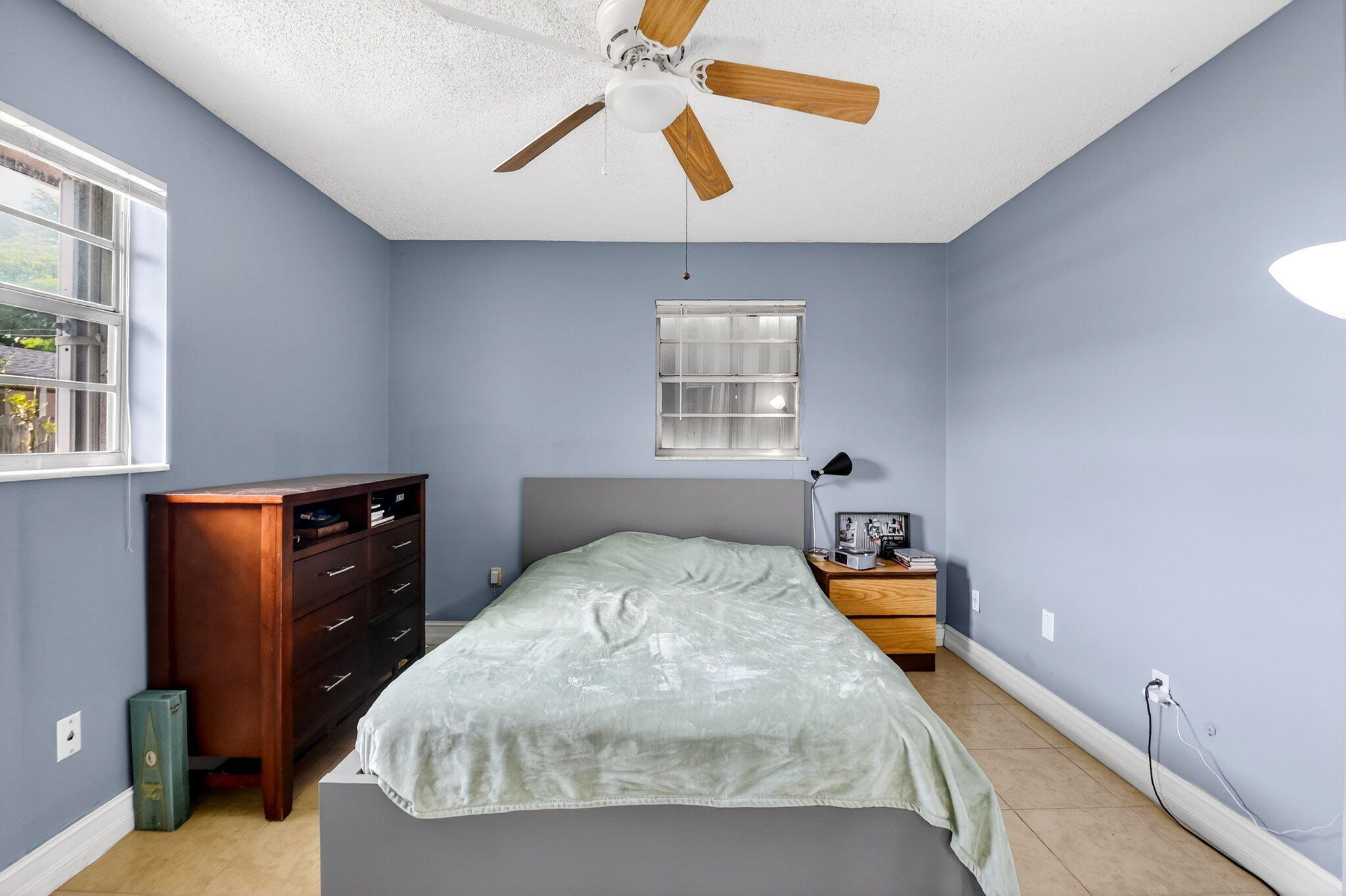 5721 Coconut Road West Palm Beach, FL 33413 - Photo 26 of 41 a bedroom with a bed and wooden floor