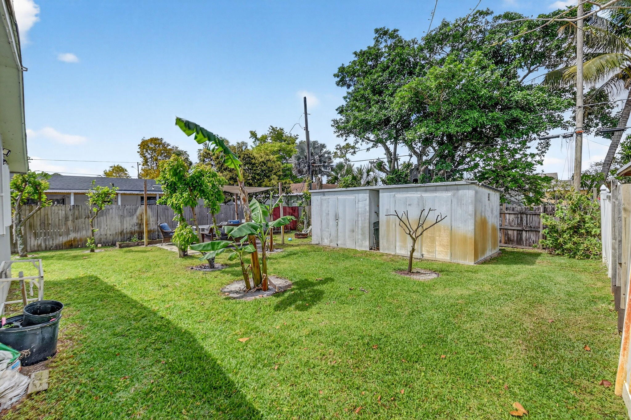 5721 Coconut Road West Palm Beach, FL 33413 - Photo 30 of 41 a garden with trees in the background