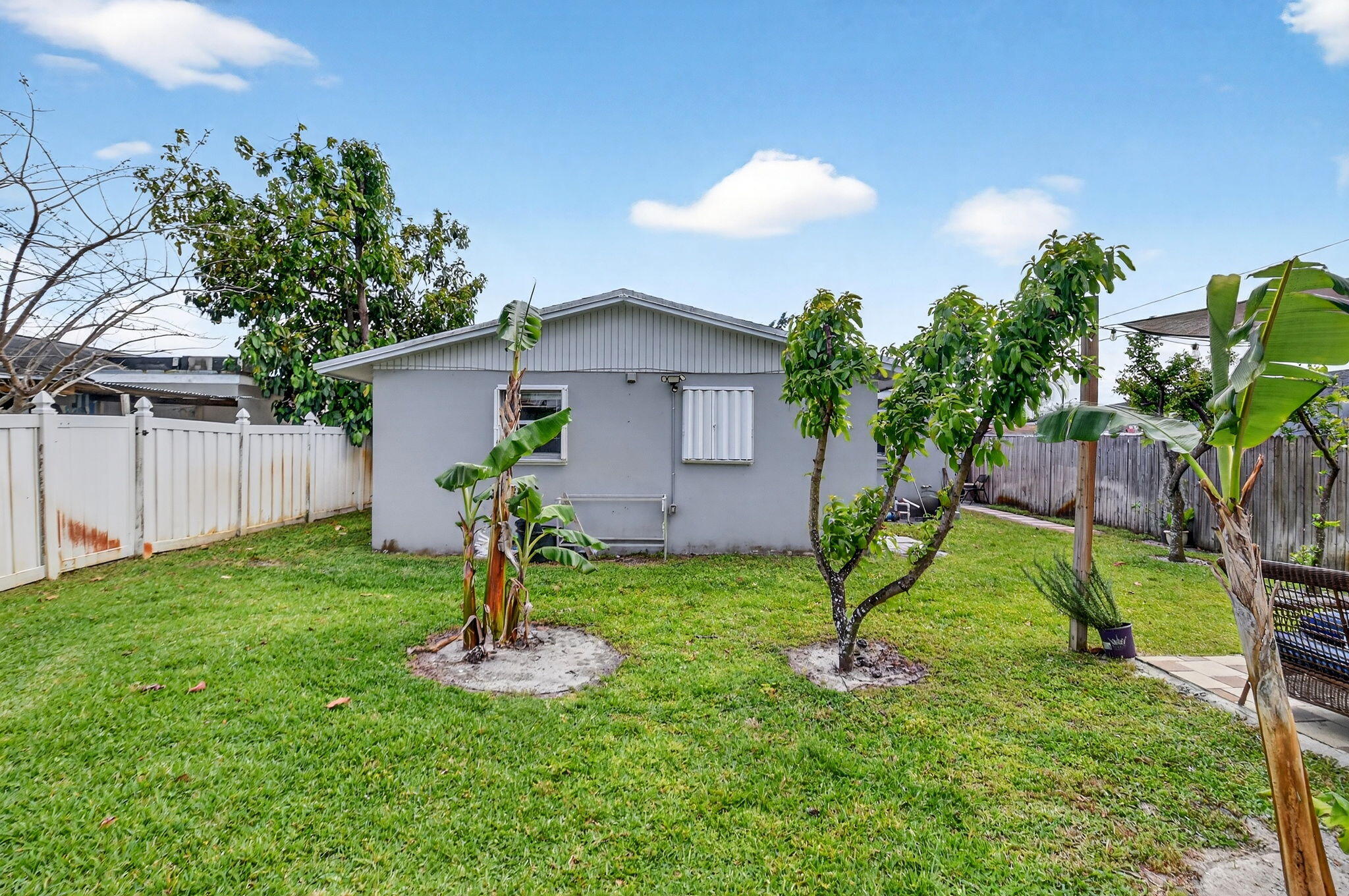 5721 Coconut Road West Palm Beach, FL 33413 - Photo 33 of 41 a view of a backyard with a garden and plants