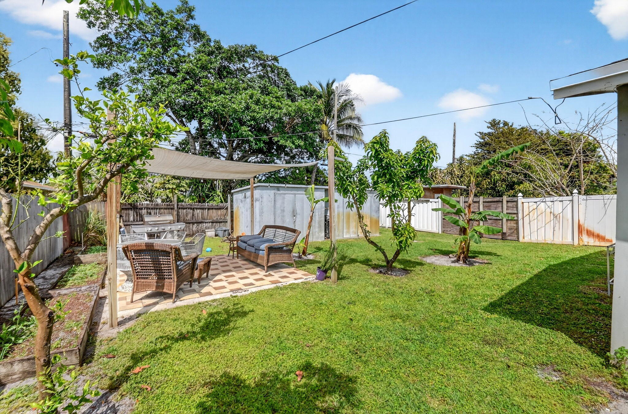 5721 Coconut Road West Palm Beach, FL 33413 - Photo 5 of 41 a view of a backyard with sitting area and slide