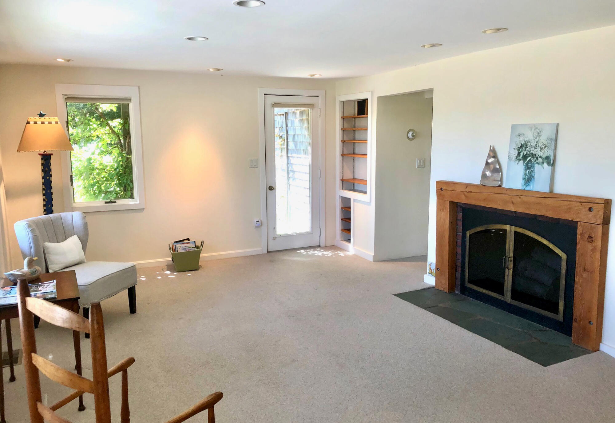 171 Monument Road Orleans, MA 02653 - Photo 13 of 47 a living room with furniture and a fireplace